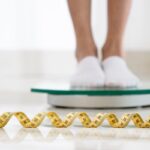 close up legs weight machine